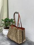 Coach Willow Tote in Signature Canvas with Rust Leather Trim