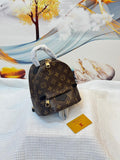 Louis Vuitton Palm Springs Mini in Monogram Reverse Canvas (Brown)