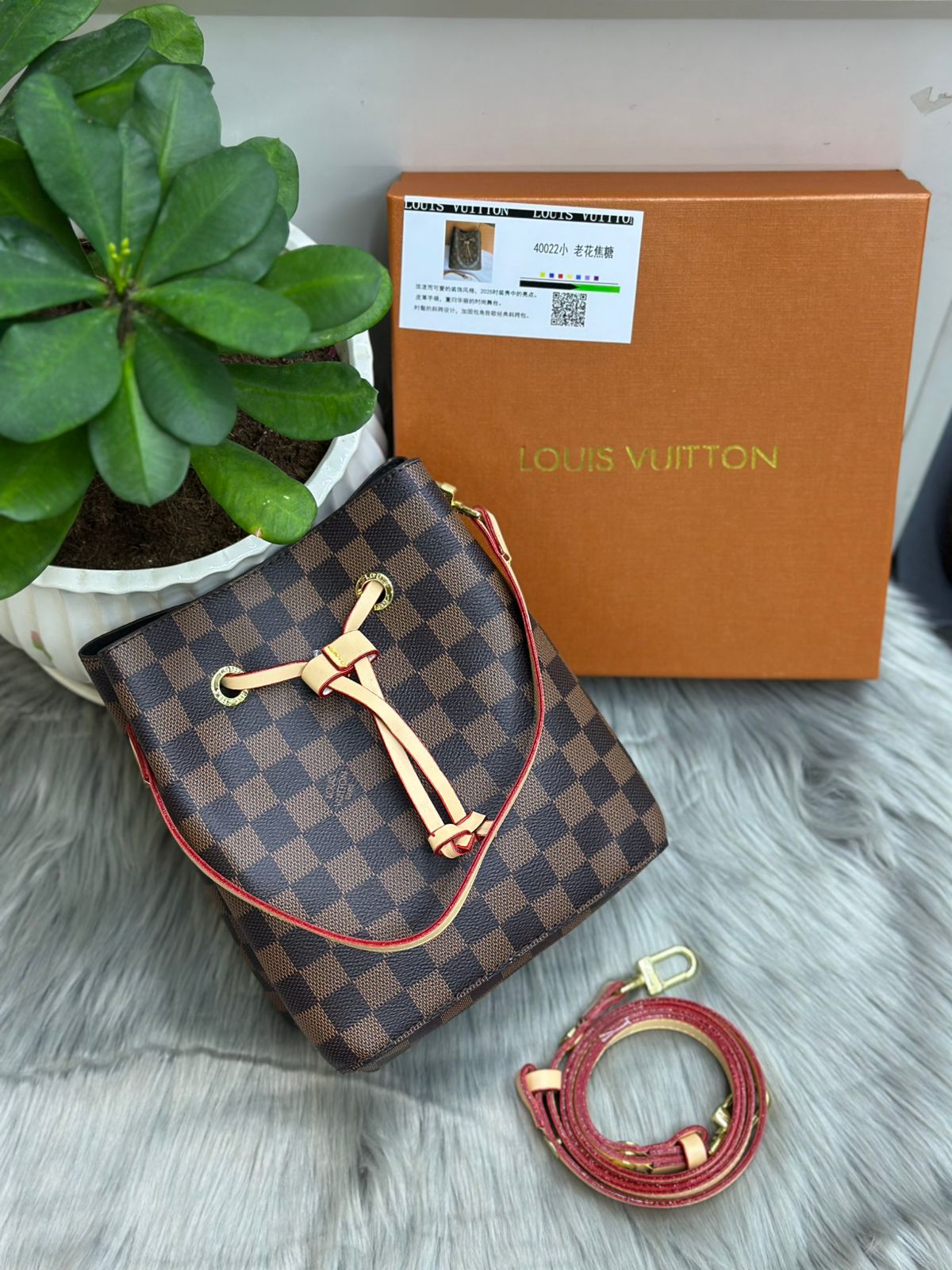 Louis Vuitton NéoNoé BB (Damier Ebene Canvas) Ebene (Brown Checkerboard) with Cherry Berry/Red trim and lining.