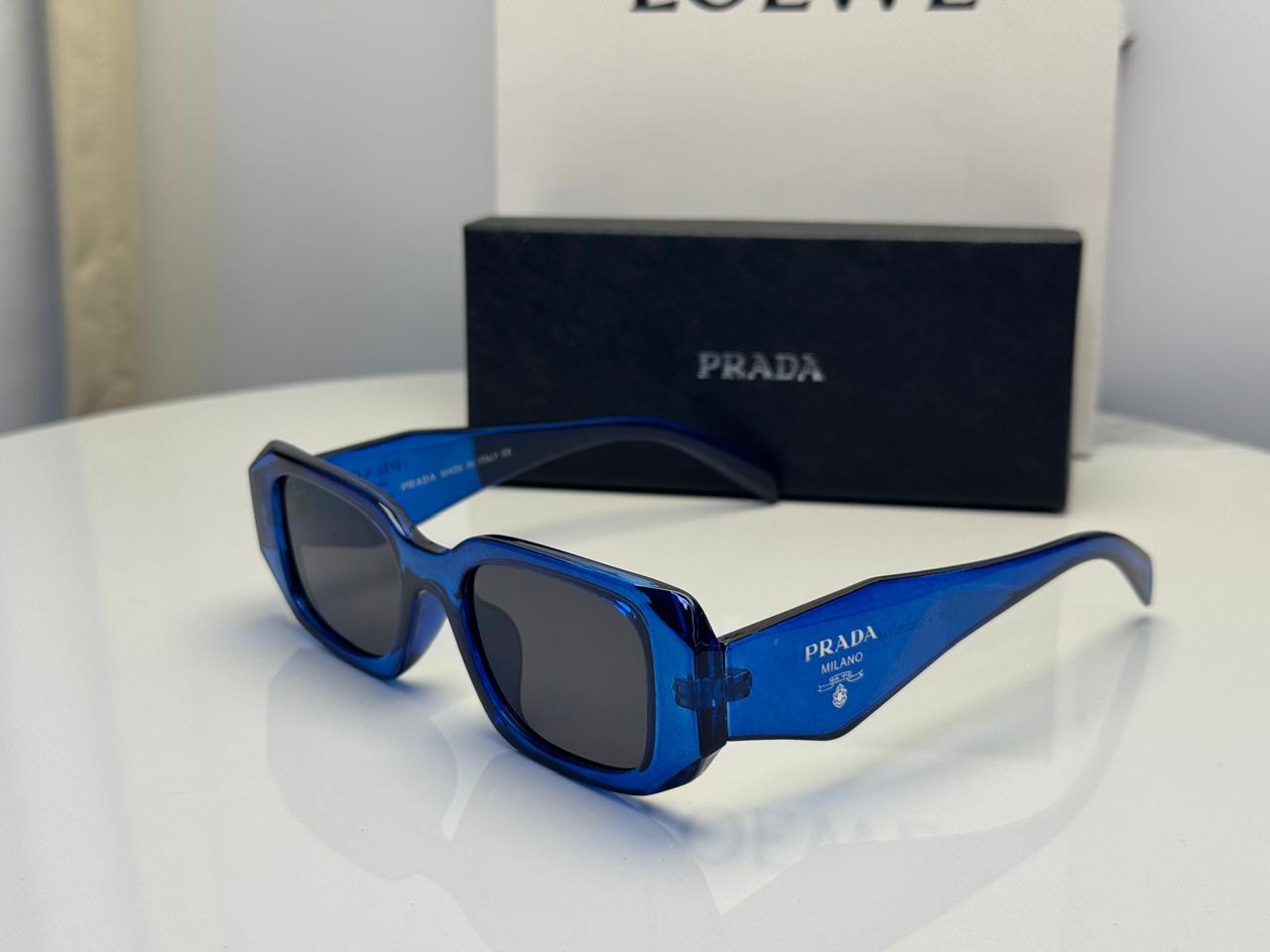 Prada Symbole Rectangular Sunglasses in Transparent Blue