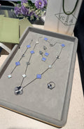 Van Cleef & Arpels Alhambra Jewelry Set (White Gold with Blue Agate, Mother-of-Pearl, and Guilloché)