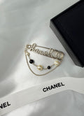 Chanel Script Logo Safety Pin Brooch (Champagne Gold/Pearl/Black)